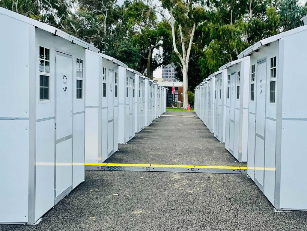Two rows of Pallet shelters for veterans in Los Angeles, CA