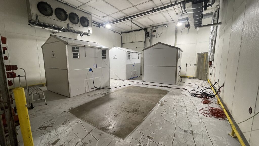 Three 64 sq. ft. Pallet shelters inside a cold chamber at SGS' testing facility in Colorado.