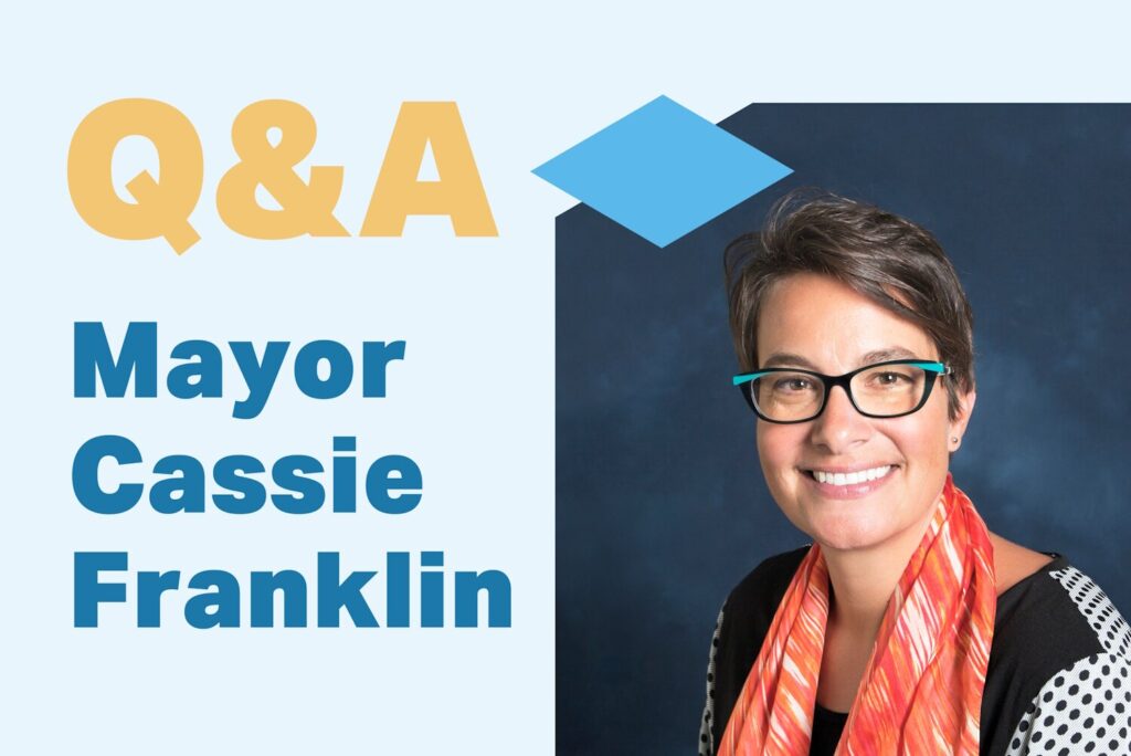 Headshot of Everett, Washington Mayor Cassie Franklin on a blue background with text that reads Q&A Mayor Cassie Franklin