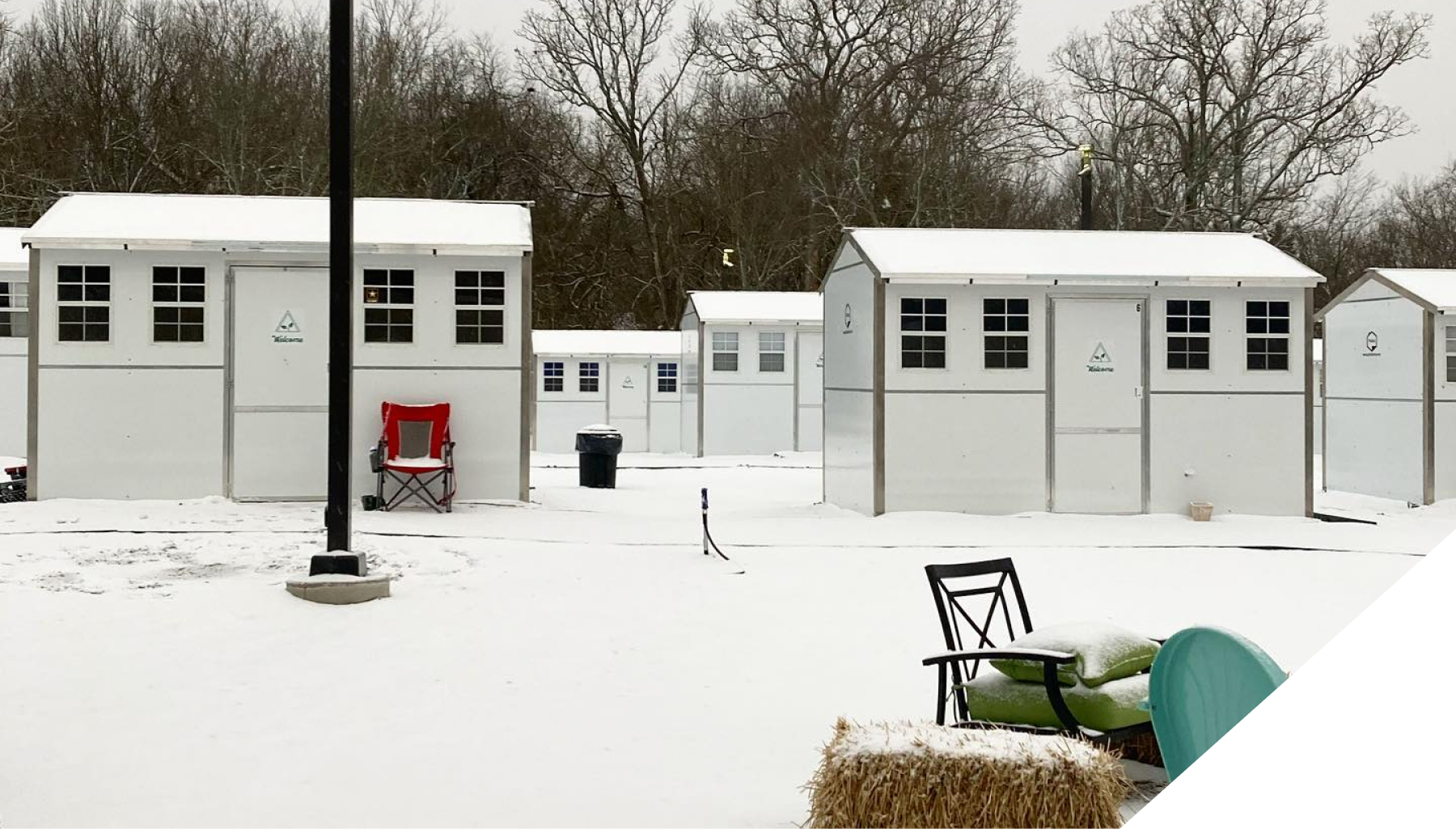 A snow-covered Pallet shelter village.